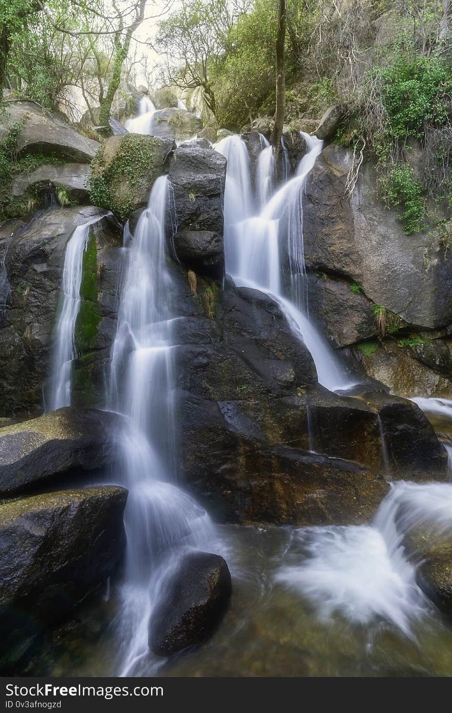 Waterfall falling slowly among the stones