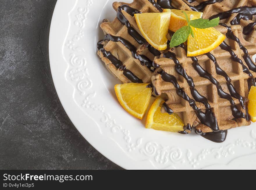 Belgian chocolate waffles with chocolate syrup