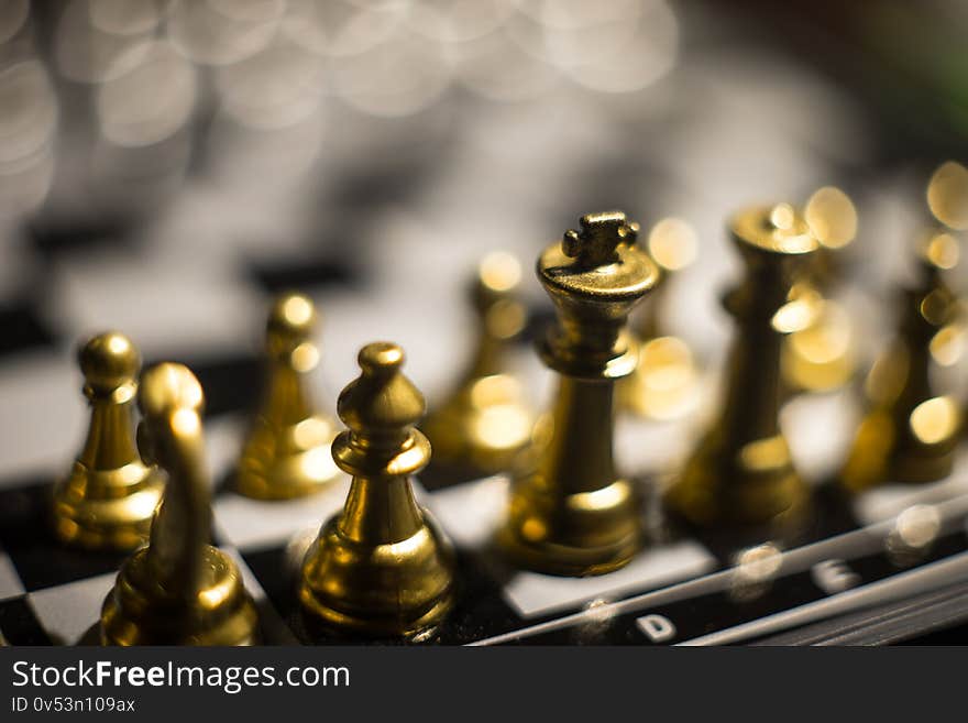 Chess board game concept of business ideas and competition. Chess figures on a dark background with smoke and fog. Selective focus