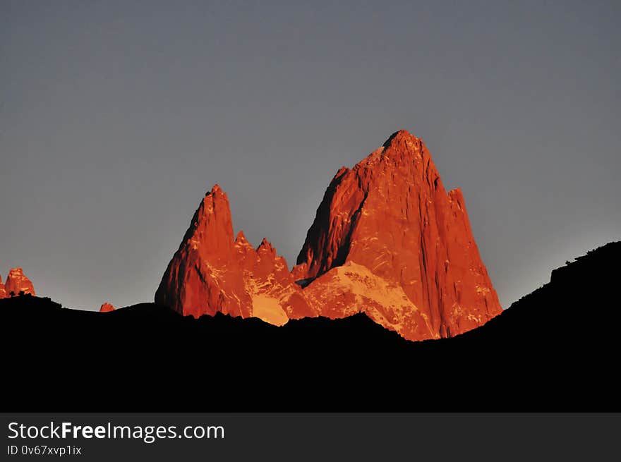 Morning view of Fitz Roy mountain with the sun revealing the red color of the rock
