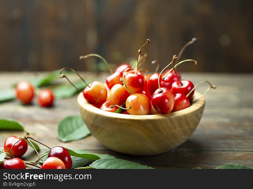 Sweet cherry in a wood plate