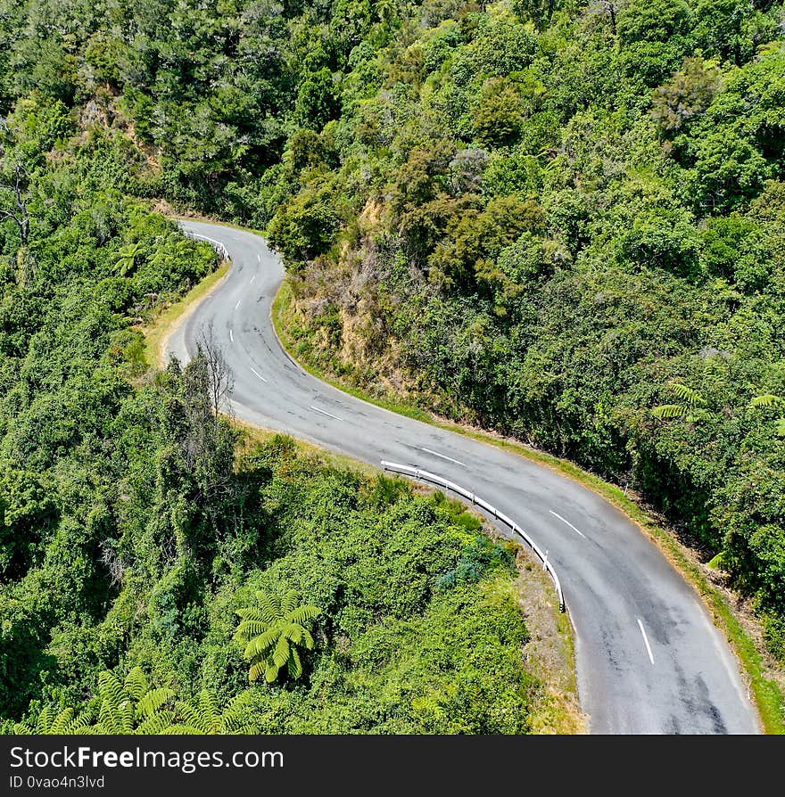 Winding Road in the tropical mountains, aerial view