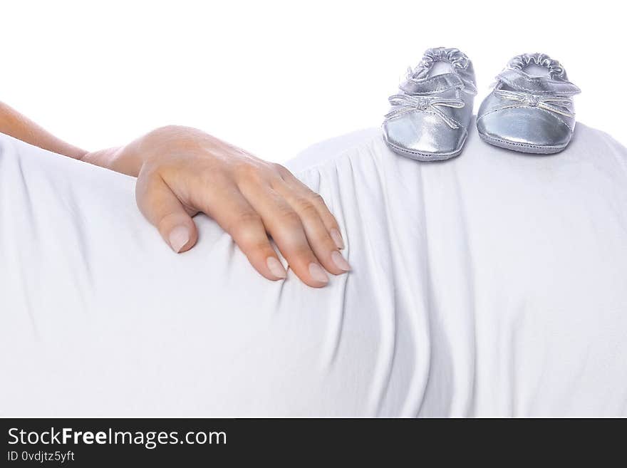 Happy Pregnant Girl Lies On White Background