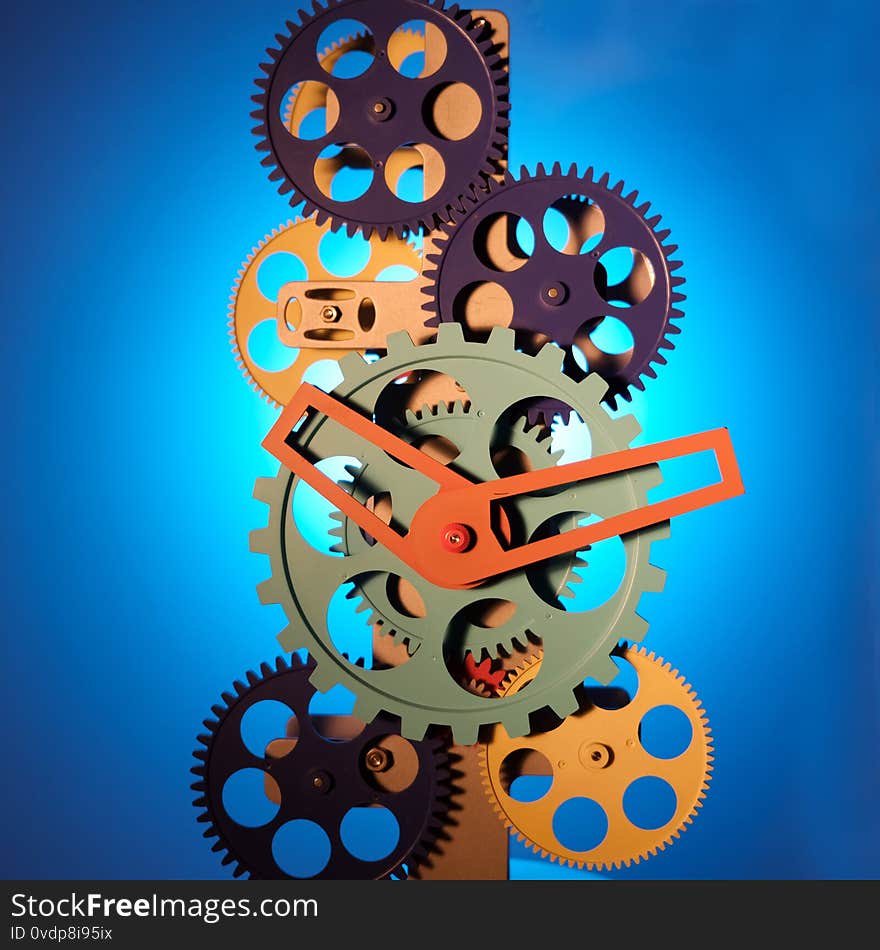   skeleton, clockwork, multi-colored rotating gears and hands, the inside of a watch, on a blue background.   skeleton, clockwork, multi-colored rotating gears and hands, the inside of a watch, on a blue background