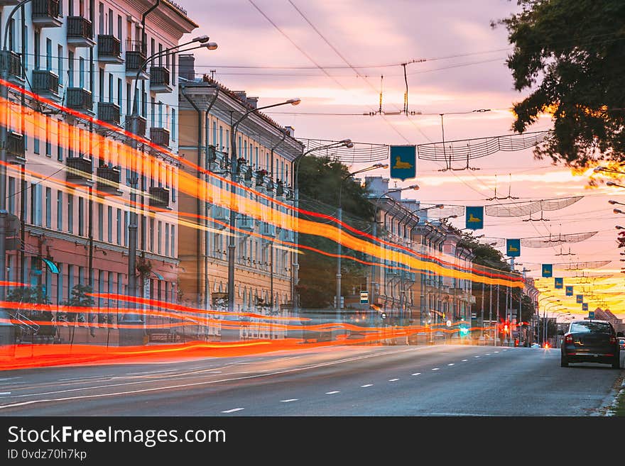 Gomel, Belarus. Speed Traffic And Light Trails On Lenin Avenue Street In Eveining Or NIght. Long Exposure. Gomel, Belarus. Speed Traffic And Light Trails On Lenin Avenue Street In Eveining Or NIght. Long Exposure.