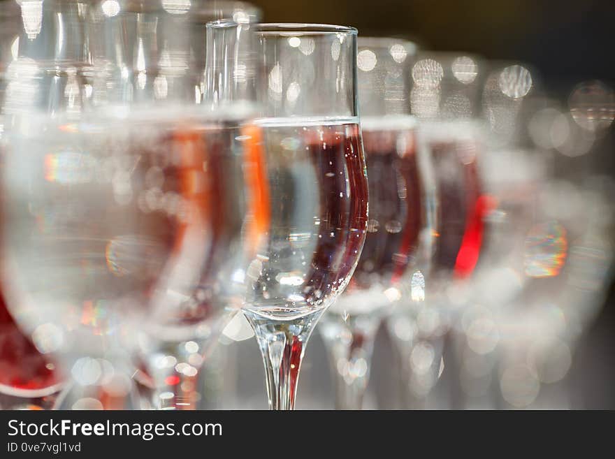 Wine Glasses with mineral sparkling water in row on bar