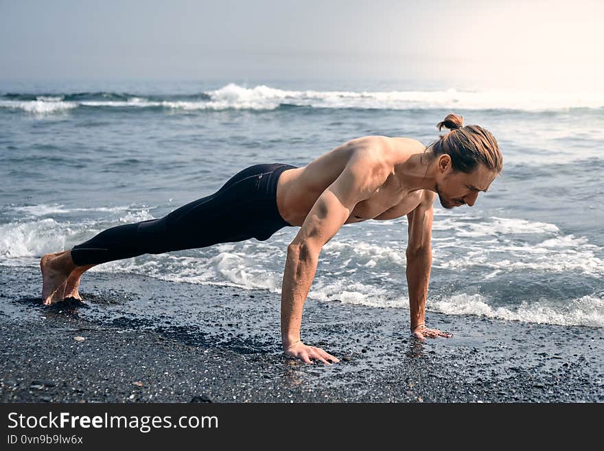 Workout Exercise. Closeup Of Healthy Handsome Active Man With Fit Muscular Body Doing Push Ups Exercises. Sporty Athletic Male Exercising At Beach, Training Outdoor. Sports And Fitness Concept. Workout Exercise. Closeup Of Healthy Handsome Active Man With Fit Muscular Body Doing Push Ups Exercises. Sporty Athletic Male Exercising At Beach, Training Outdoor. Sports And Fitness Concept