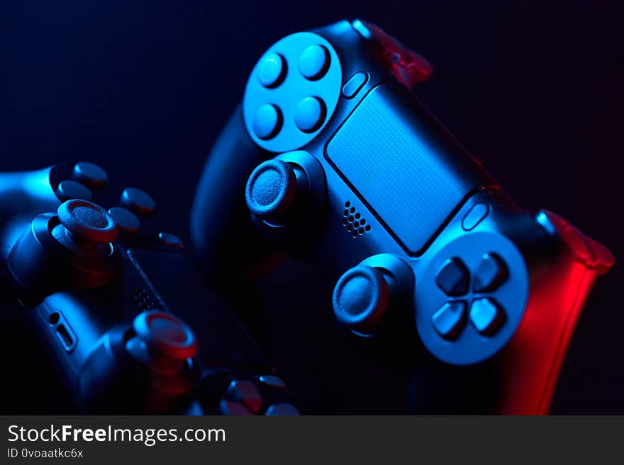 Game controller, videogame joystick or gamepad on a table. Close up studio shot . Game concept