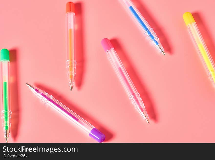 Workplace with stationery accessories on pink countertop. Business or back to school concept