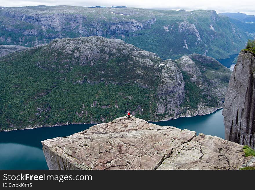 The famous Preikestolen, Pulpit Rock in the evening above  Lysefjord, peaceful, tranquil, nature landscape