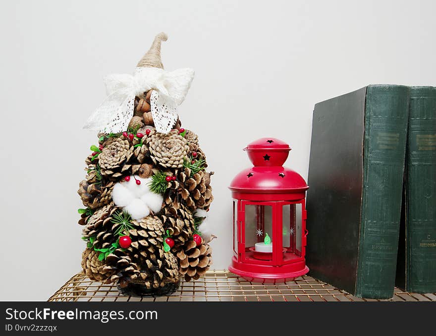 Craft from cones and cotton flowers. Berries and winter greens. Craft from cones and cotton flowers. Berries and winter greens