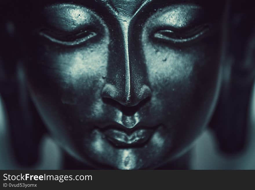 Close up of statue of buddha white background for text