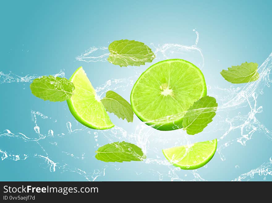 lime and mint, water splash  on blue background