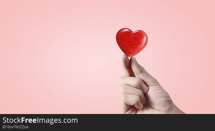 Hands holding red heart. heart health. and donation concepts