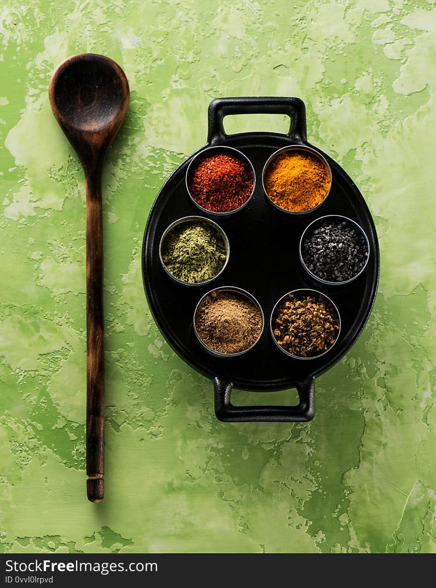 Powder spices; seasoning; spicy and herbs on a dark background. Indian spices, top view