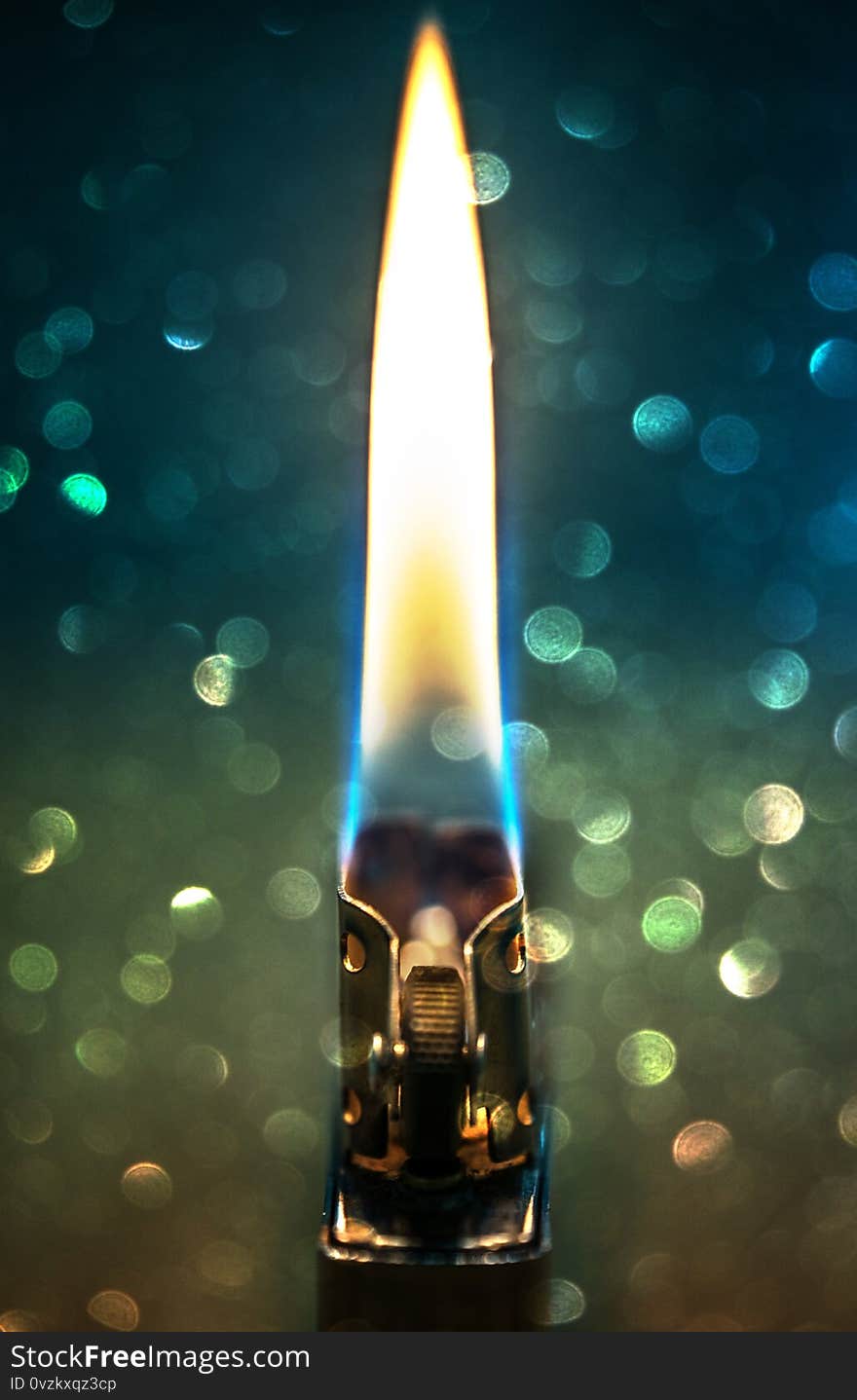 Zippo Lighter Closeup With Flame Bokeh Background