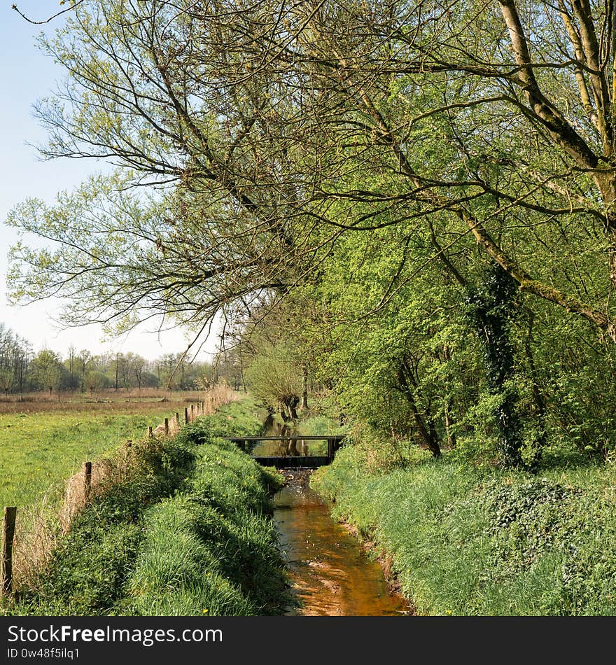 Small water with bridge in the South of The Netherlands nearby the Collse Watermill. Small water with bridge in the South of The Netherlands nearby the Collse Watermill.