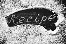 Headline Recipe Sprinkle Flour On A Black Table. Banner Recipe Handwritten Word Royalty Free Stock Image