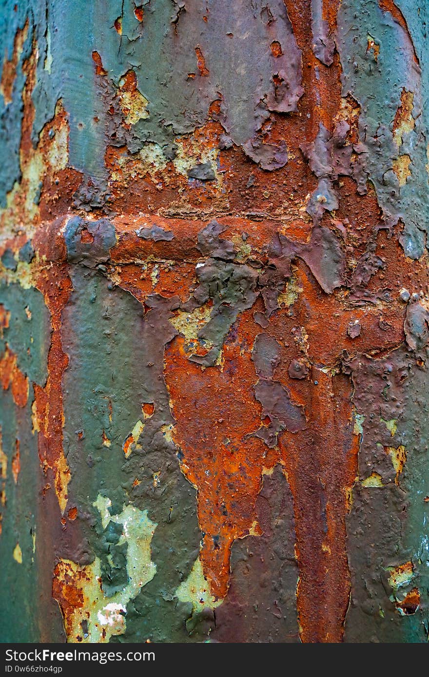 Rusted metal corrugated metal background. Rusty metal background with streaks of rust. Rust stains