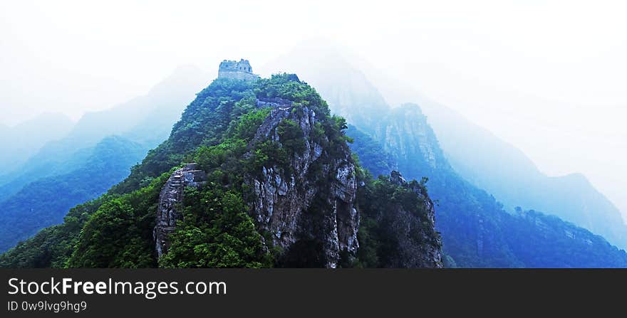 As a summer storm is coming, the colour of the Great Wall landscape has turned to several layers. There is no rainy season in Beijing area, but most rains come in summer and normally on a day - and - night shift.