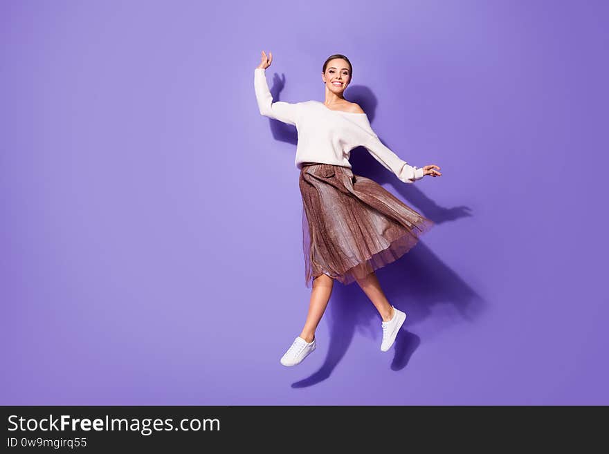 Full length body size view of her she nice attractive charming fashionable, cheerful girl jumping walking having fun isolated on bright vivid shine vibrant lilac violet purple color background. Full length body size view of her she nice attractive charming fashionable, cheerful girl jumping walking having fun isolated on bright vivid shine vibrant lilac violet purple color background