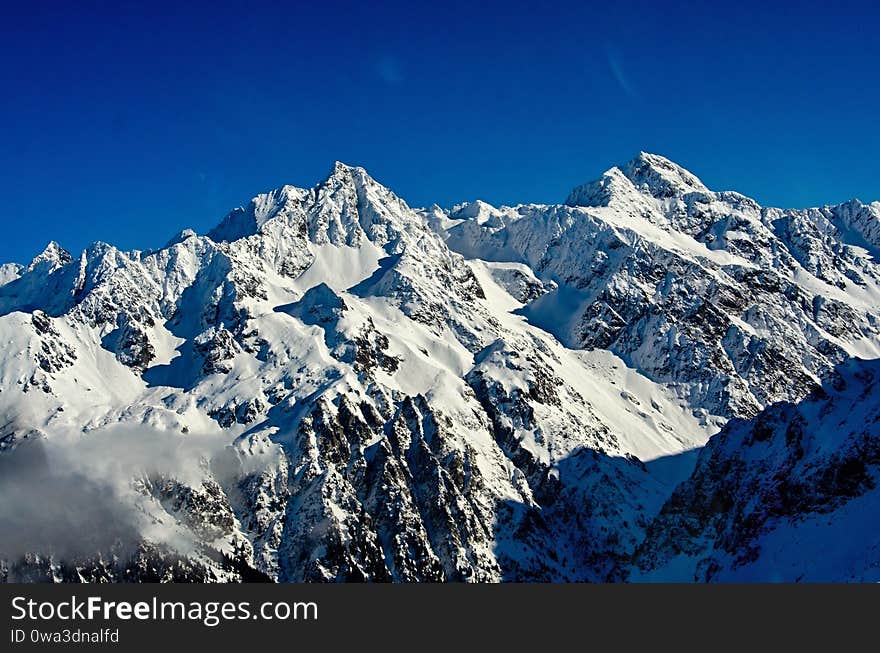 La chaine de Belledonne in the French alps. A fantastic winter panoramic mountain view. La chaine de Belledonne in the French alps. A fantastic winter panoramic mountain view.