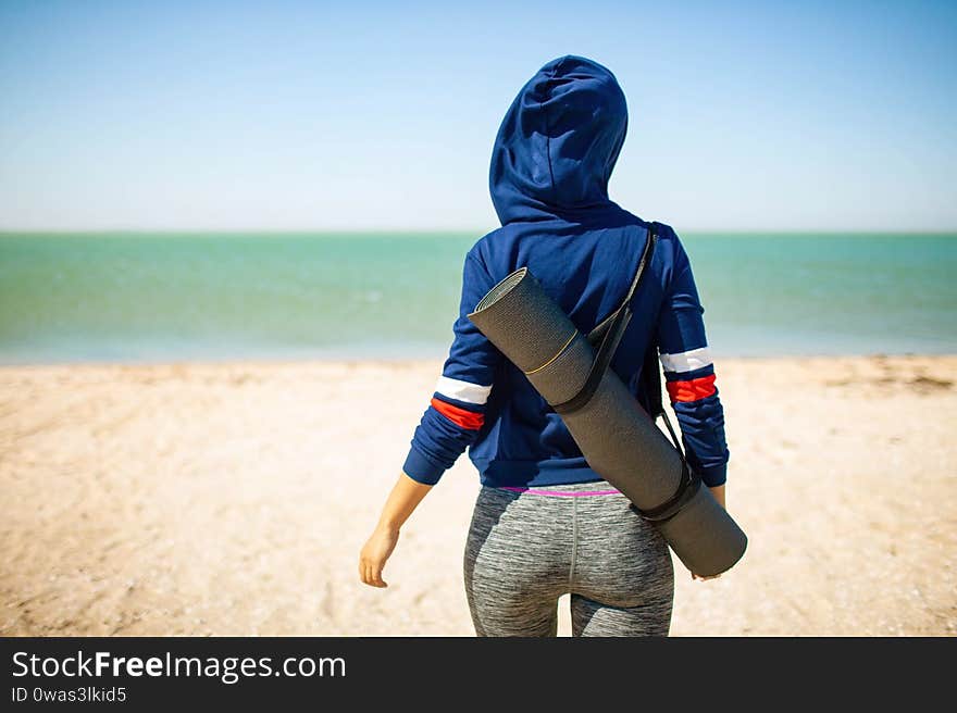 Composite Image Of Woman In Sports Clothing Against Sea