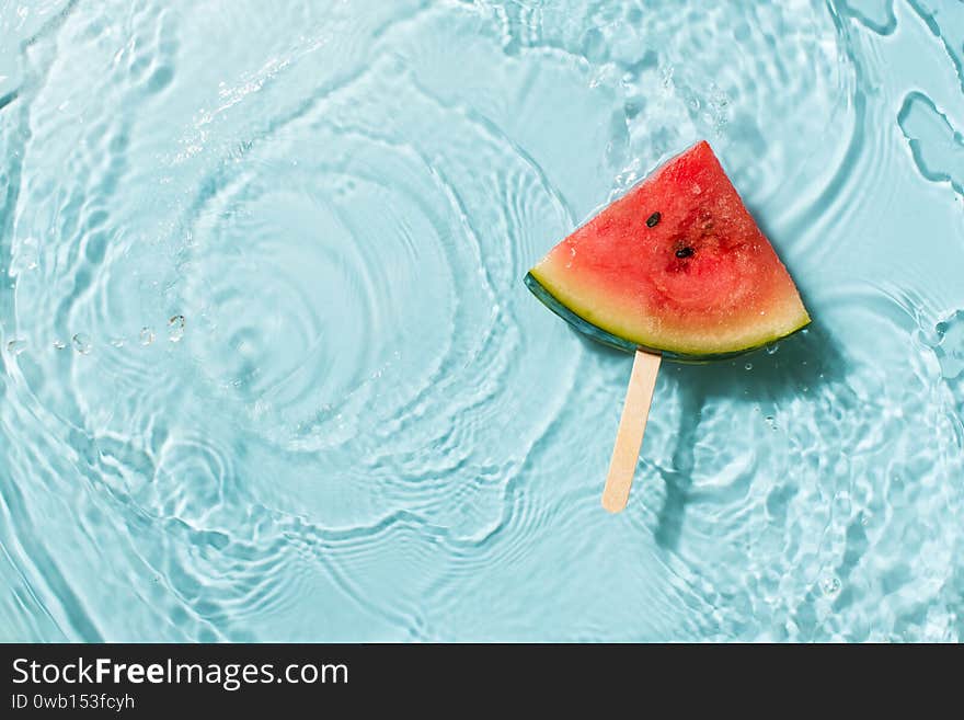 Wayermelon slice in water blue background, freshness, transparency