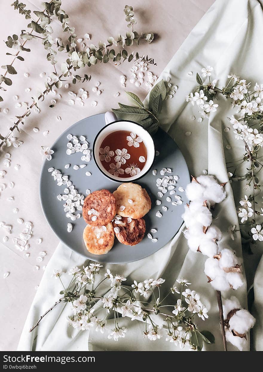 Spring Healthy Breakfast Fried Cheesecakes, Against A Blooming Bouquet Flowers