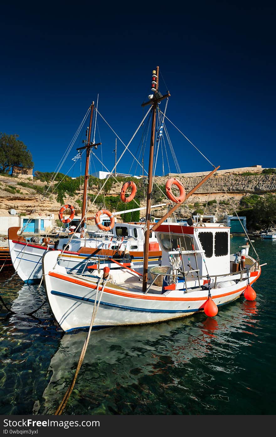 Fishing boars in harbour in fishing village of Mandrakia, Milos island, Greece