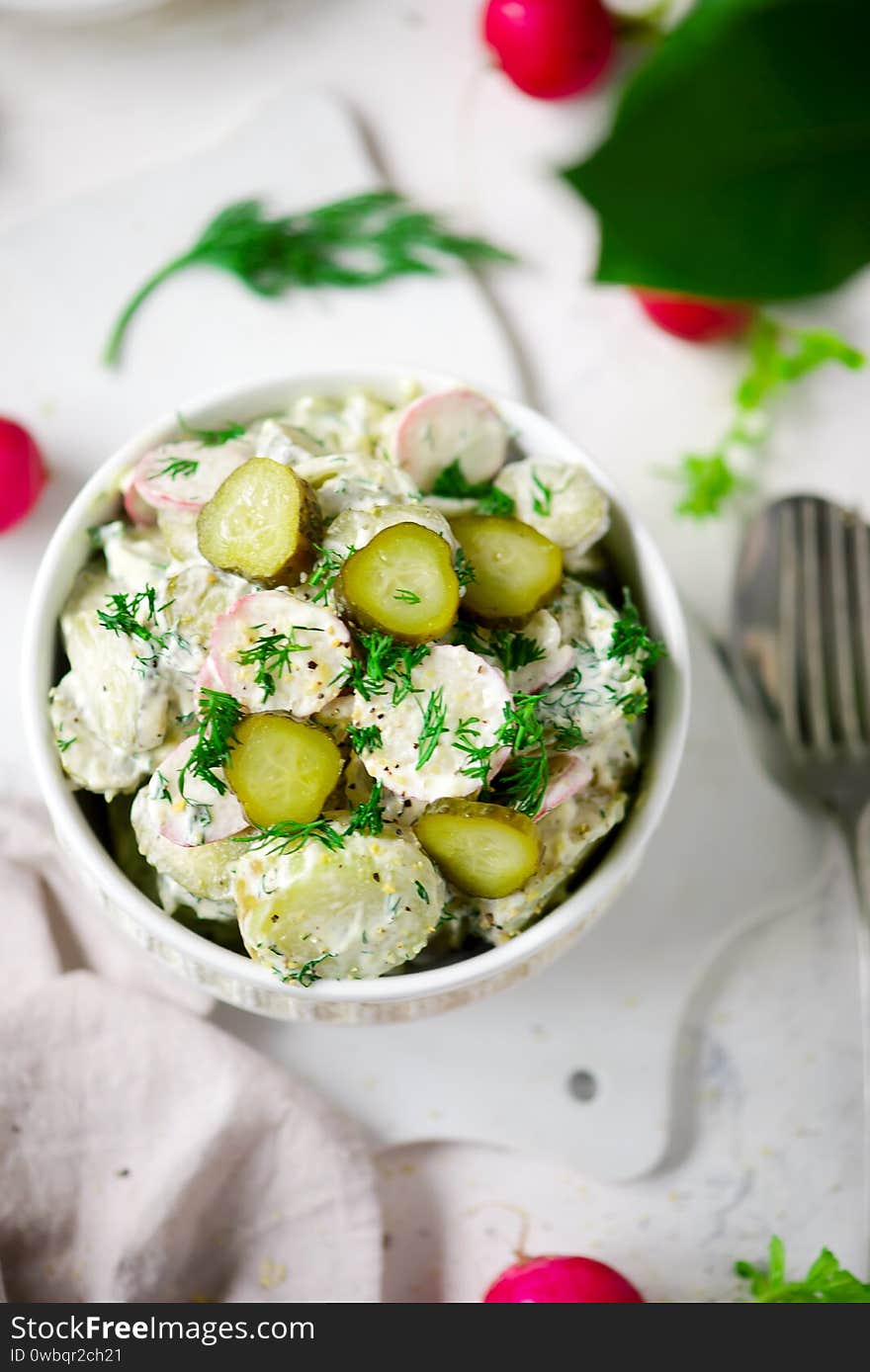 Dilled potato and pickled cucumber salad.. selective focus. Dilled potato and pickled cucumber salad.. selective focus