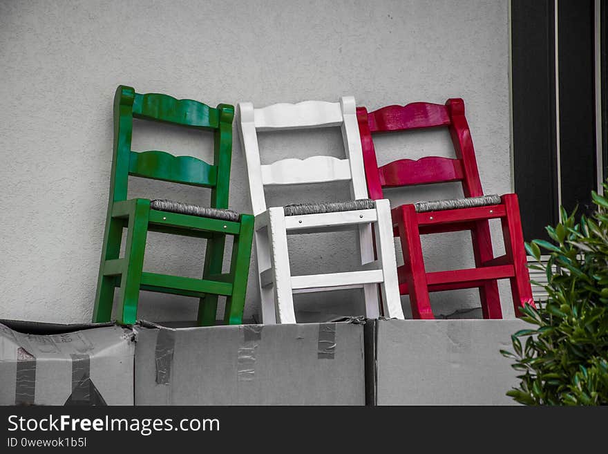 Green, white and red colored chairs form the Italian flag. Green, white and red colored chairs form the Italian flag