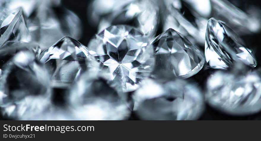 Small Diamonds on dark background as close up shot selective focus