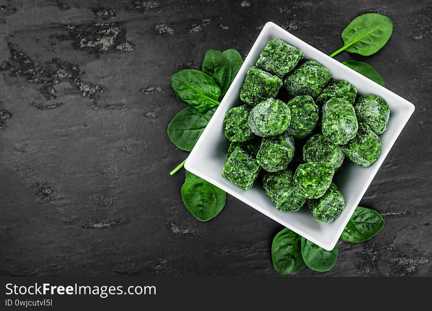 Portion of frozen spinach close up; selective focus