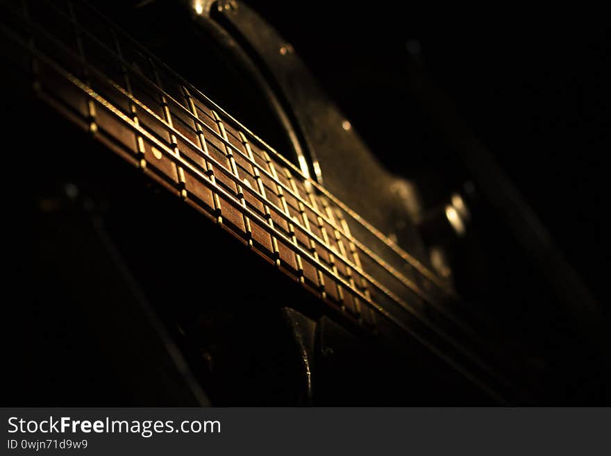 Bass guitar in music studio shot at golden hour