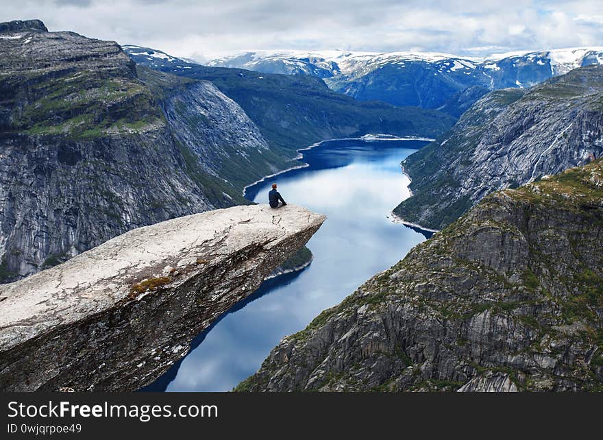 Man enjoying view from Skjeggedal rock. Man enjoying view from Skjeggedal rock