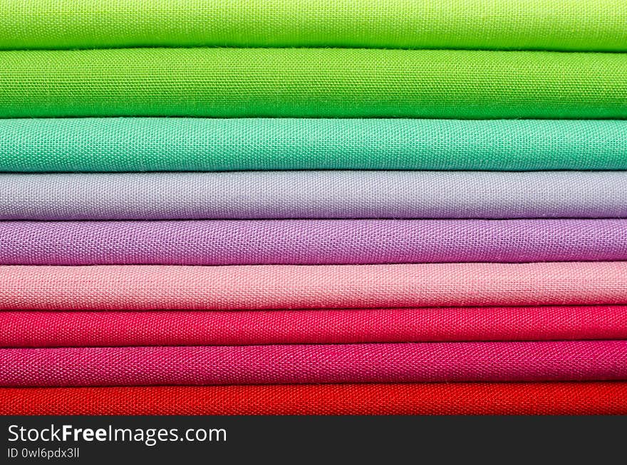 Textiles in green, pink and red tones