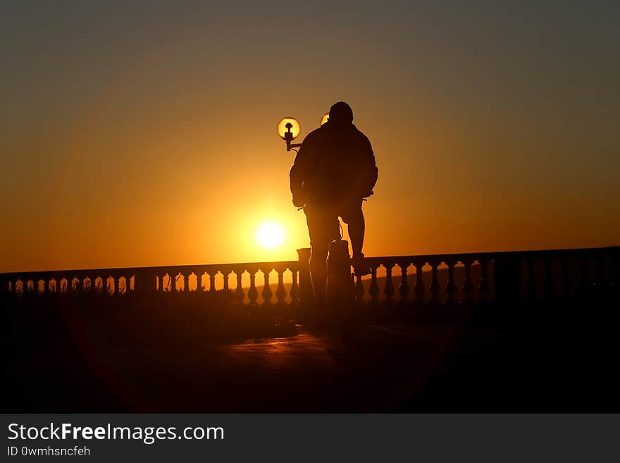 Photos of athletes on bicycles at sunset