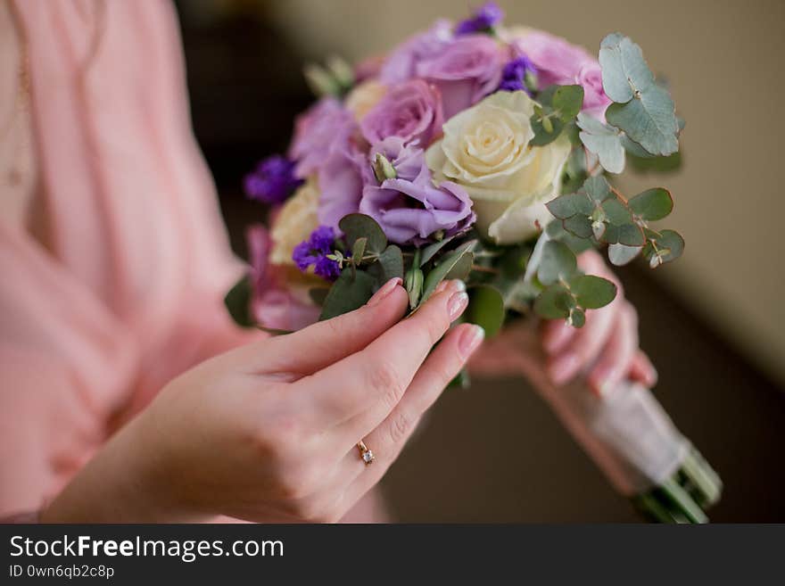 Woman In Peignoir With A Wedding Bouquet