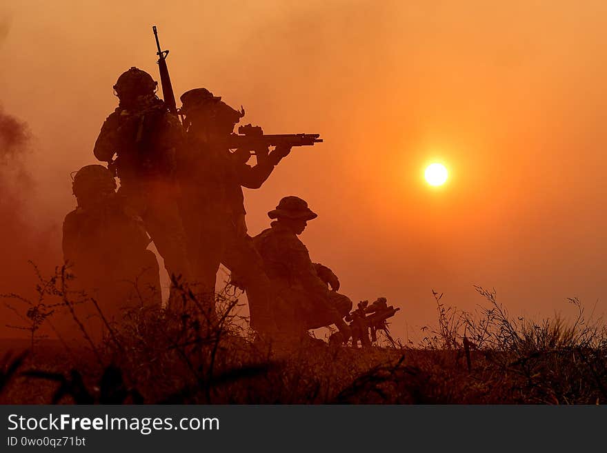 The silhouette of a military soldier with the sun as Marine Corps for military operations