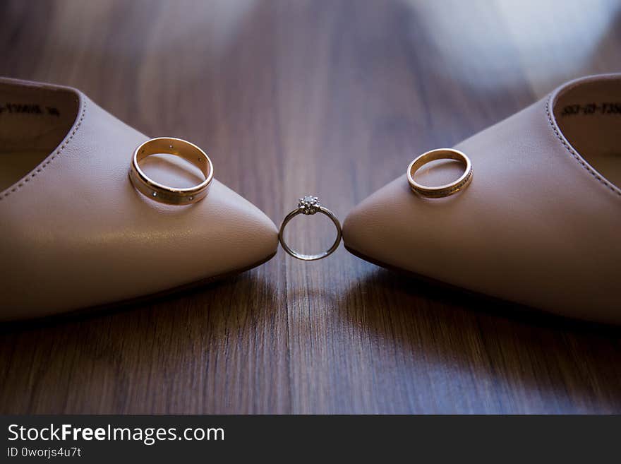 A wedding shoes with wedding rings