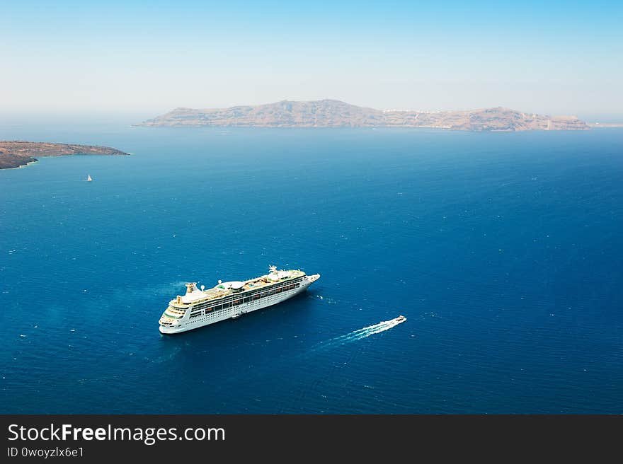 Cruise ship in the sea near Santorini island, Greece. Beautiful sea view. Famous travel destination