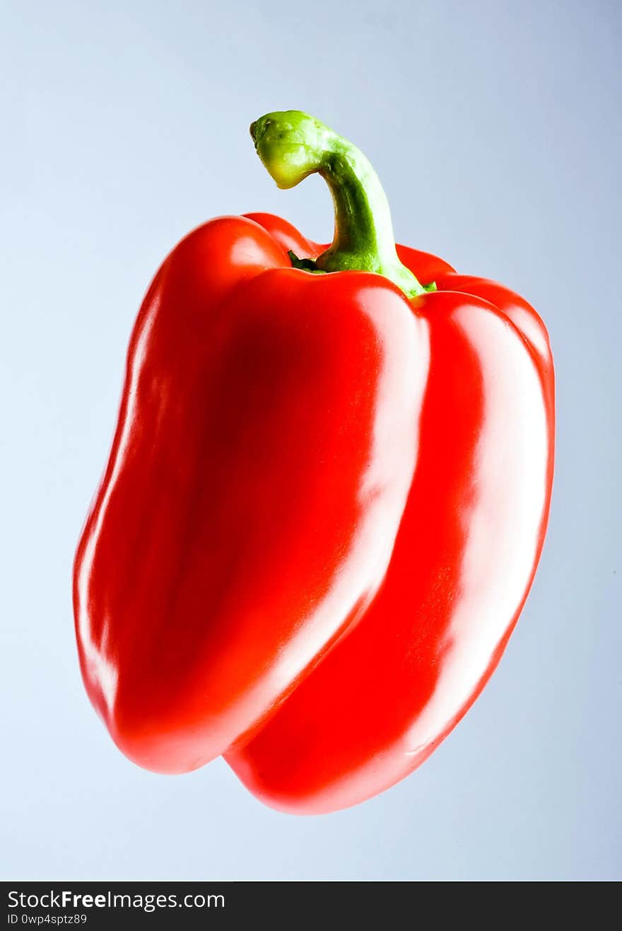 Red bright pepper close up in white background. Red bright pepper close up in white background