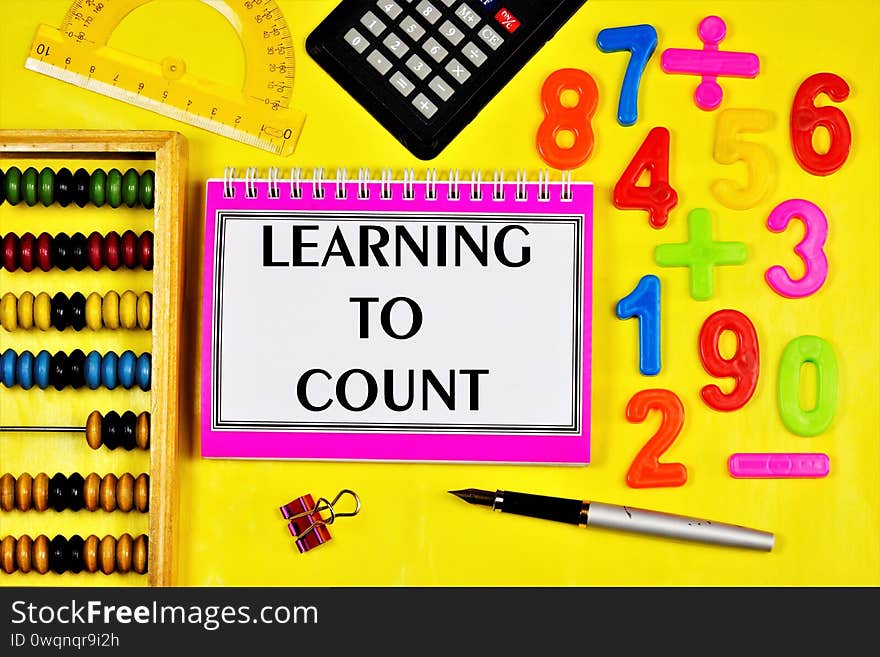 Learning to count-the inscription of the text in the student`s task book. Mathematical calculations at school in the classroom
