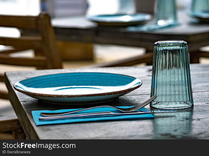 Laid table with plate, glass and cutlery