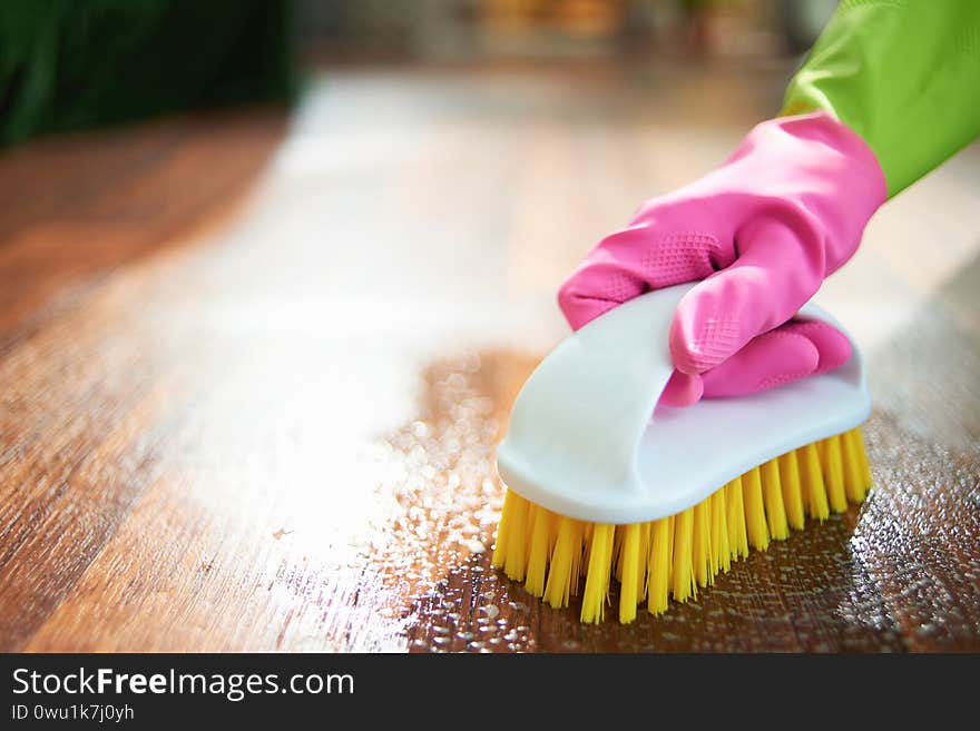 Closeup On Woman With Brush Wet Cleaning Floor