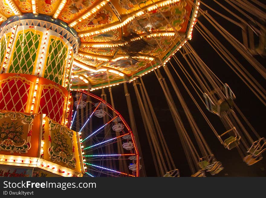 Swing ride with lights at a carnival at night