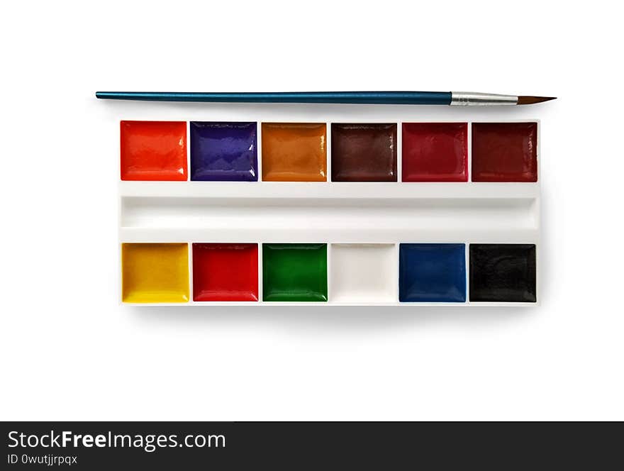 Set of watercolor paints in white container