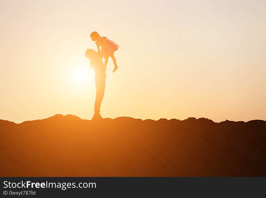 Silhouette Of A Happy Family And Happy Time Sunset