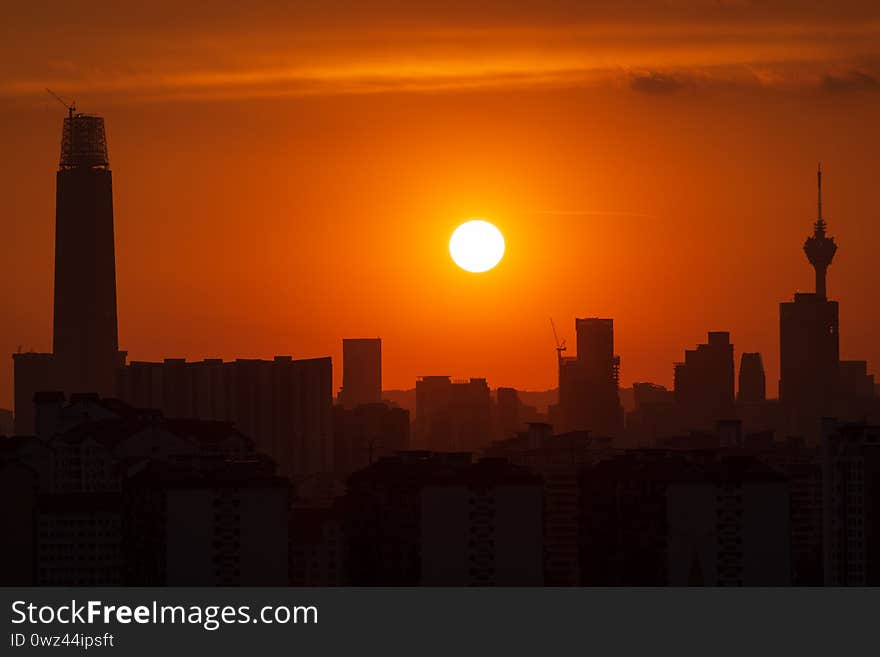 Majestic sunset over skyscrapers and surrounded buildings in downtown